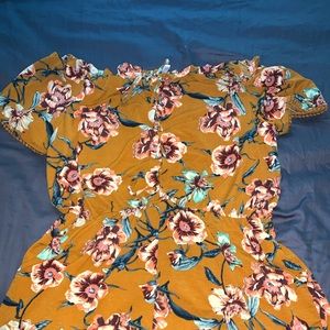 Yellow floral romper with pockets!